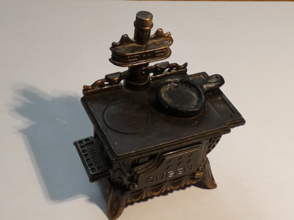 Antique metal stovetop pencil sharpener.