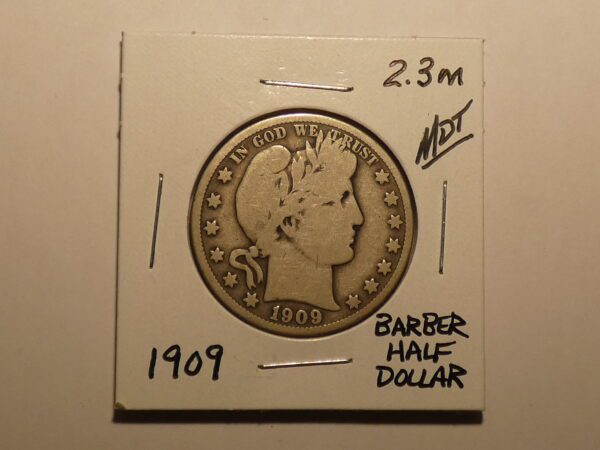 1909 Barber half dollar coin.