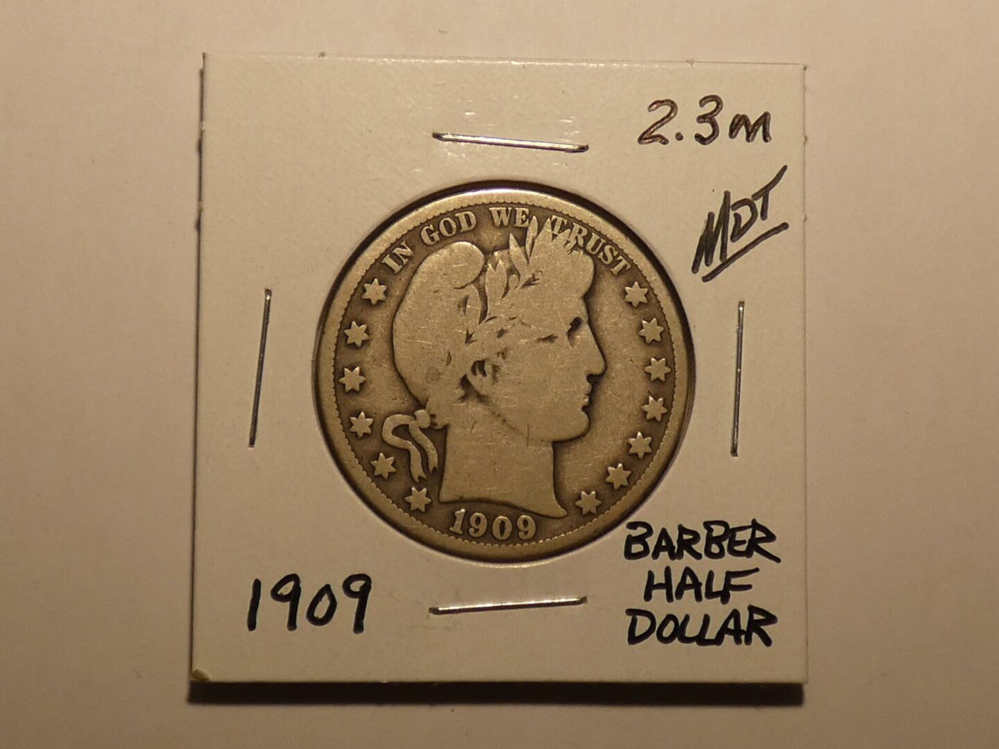 1909 Barber half dollar coin.