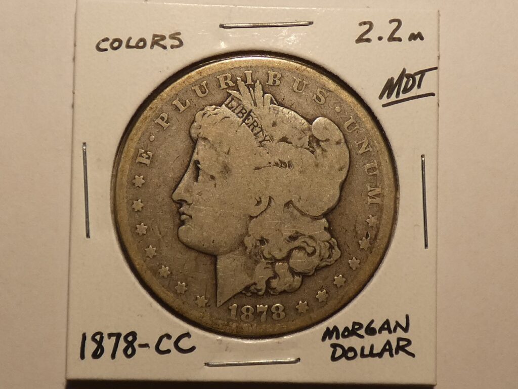 1878-CC Morgan silver dollar coin.