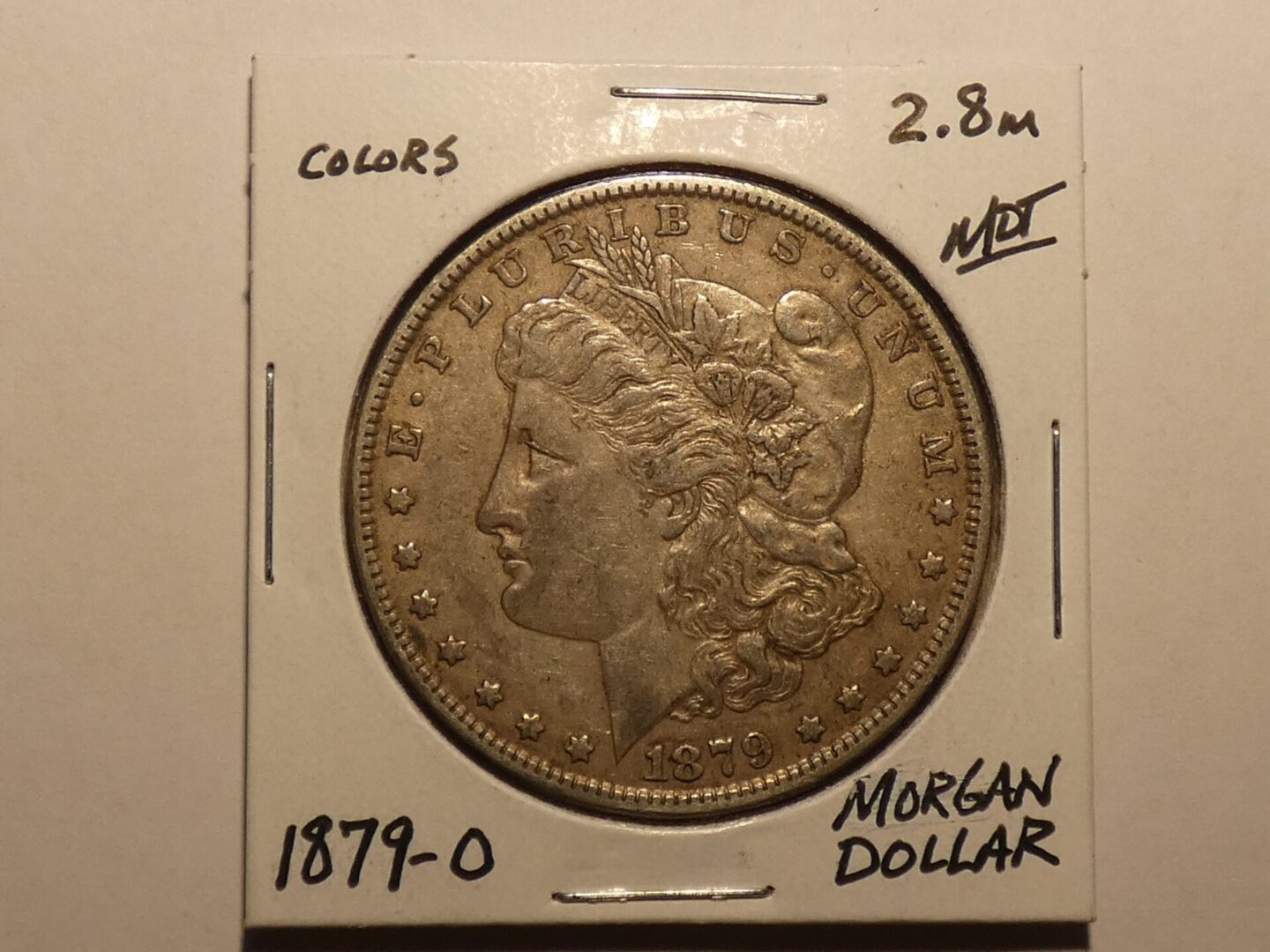 1879 Morgan silver dollar coin.