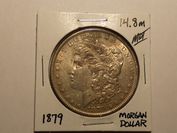 1879 Morgan silver dollar coin.