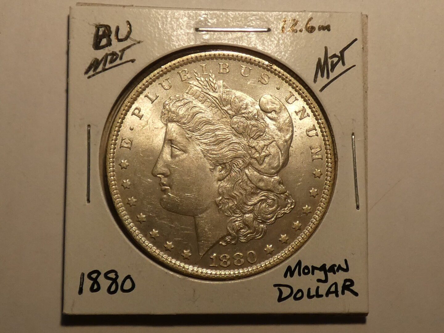 1880 Morgan silver dollar coin.