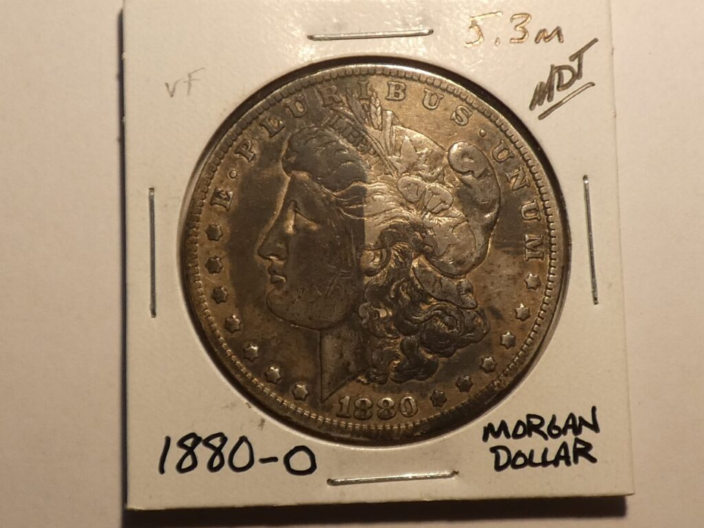 1880-O Morgan silver dollar coin.