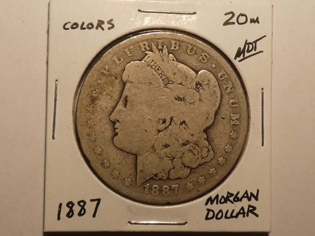 1887 Morgan silver dollar coin.