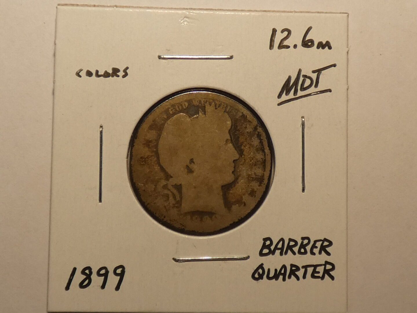 1899 Barber quarter in holder.