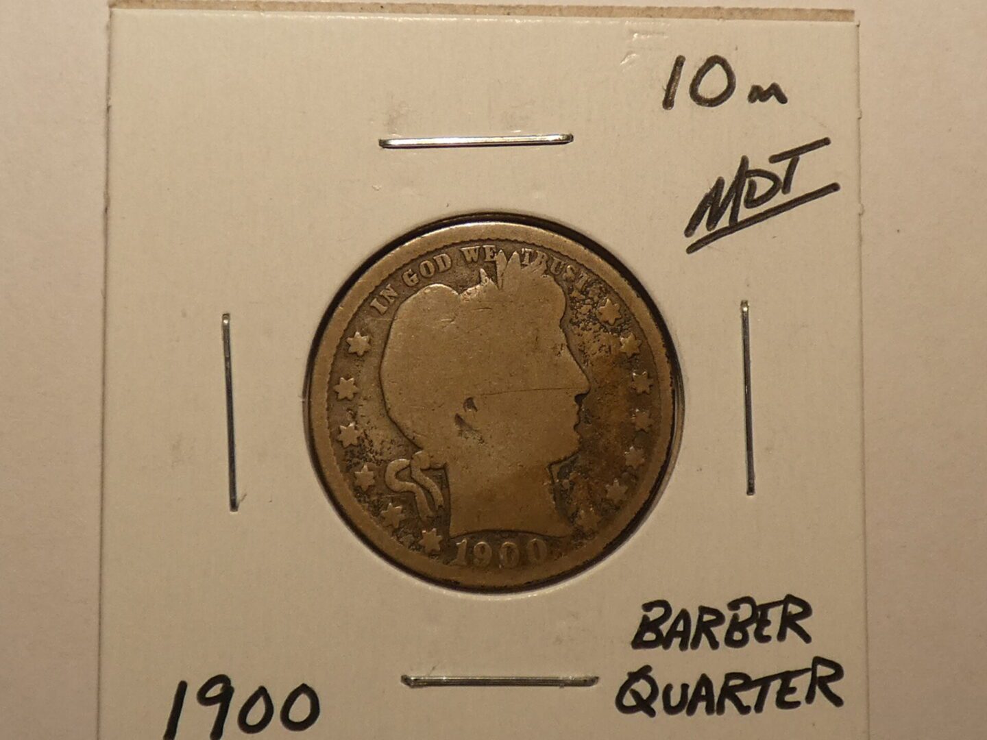 1900 Barber quarter coin, obverse side.