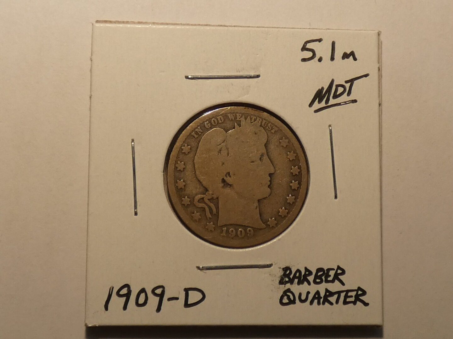 1909-D Barber quarter coin.