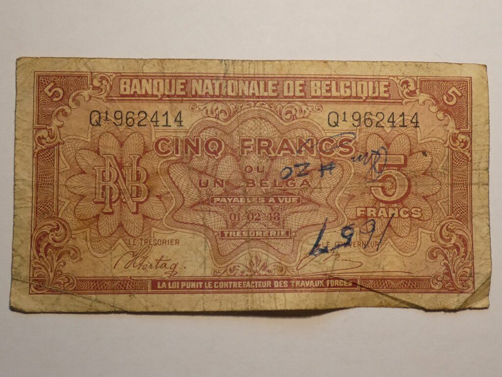 Belgian five franc banknote with ornate design.