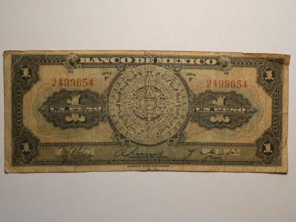 Mexican one peso banknote with Aztec calendar.