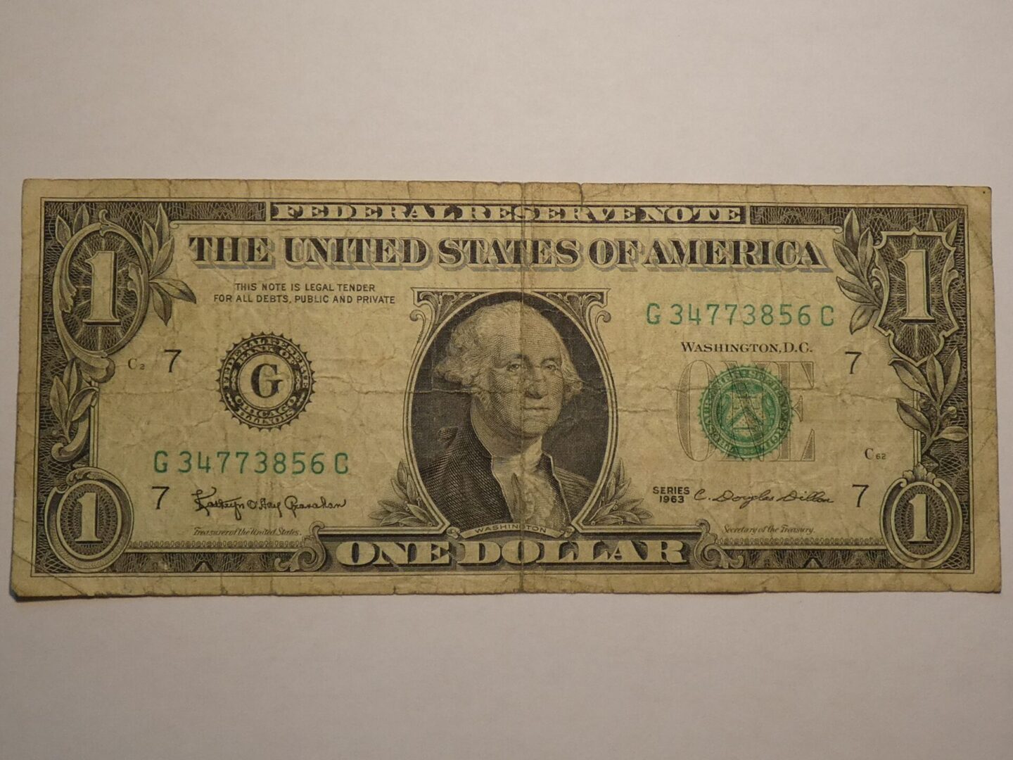 One dollar bill with George Washington.