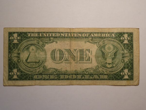 One dollar bill with an eagle and pyramid.