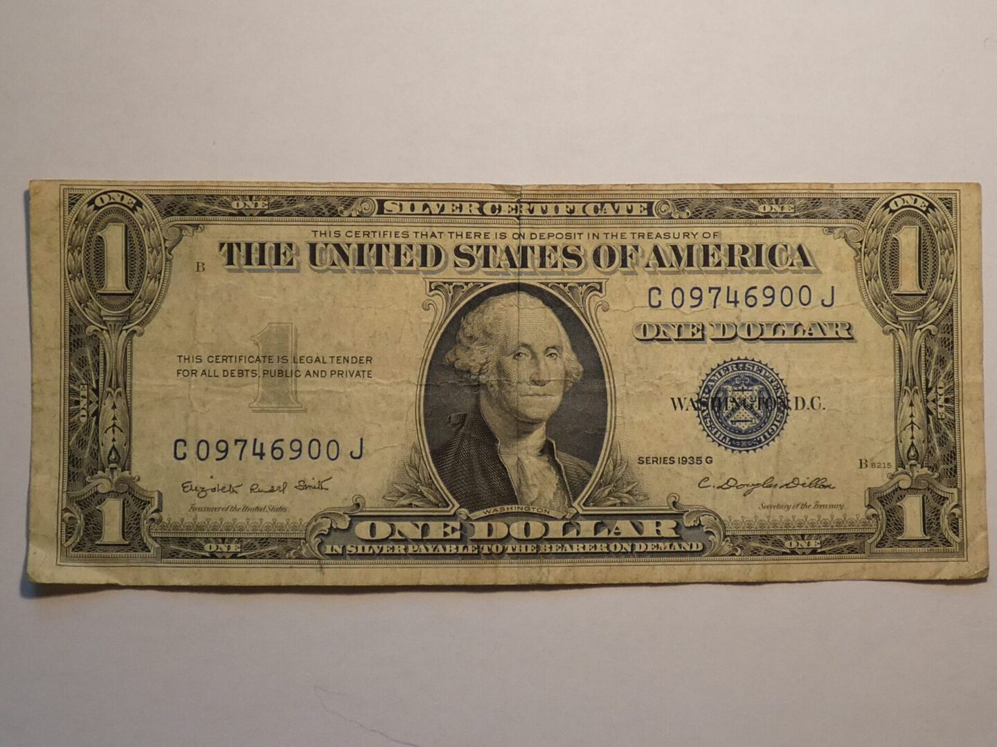 One dollar silver certificate, George Washington portrait.