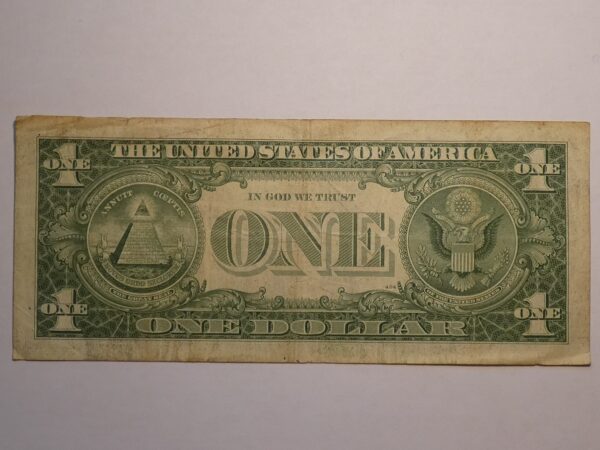 One US dollar bill with the Great Seal.