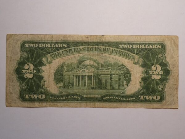 Two dollar bill with Monticello image.