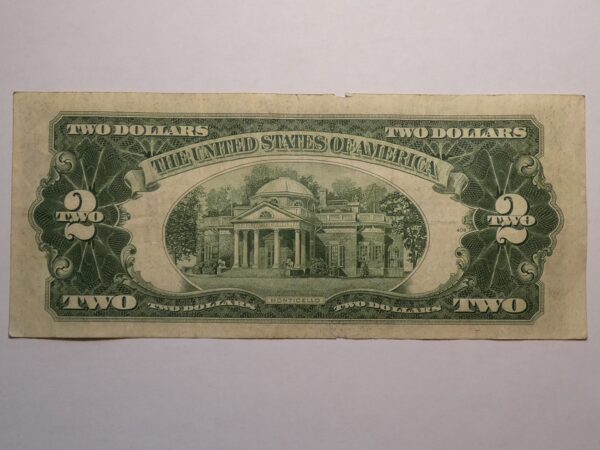 Two dollar bill with Monticello image.