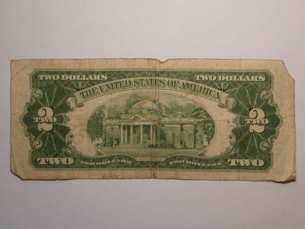 Two dollar US bill with building image.