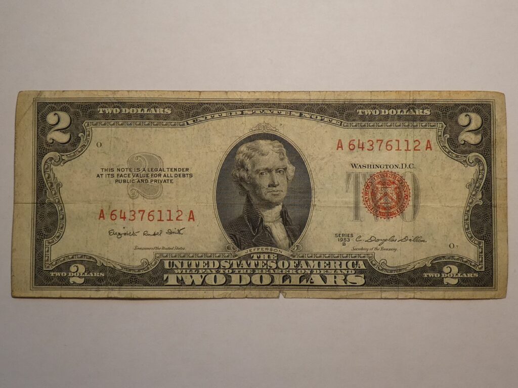 Two dollar bill with portrait of Jefferson.