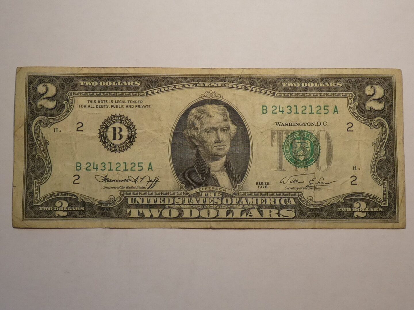 Two dollar bill with Thomas Jefferson portrait.