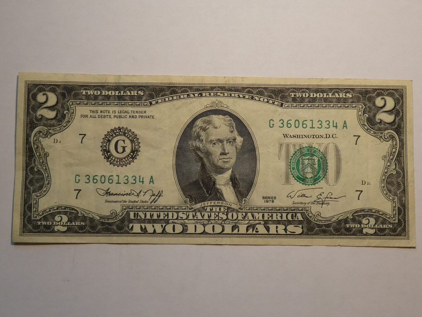 Two dollar bill with Thomas Jefferson portrait.