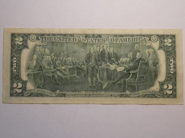 Two dollar bill depicting the signing of the Declaration of Independence.