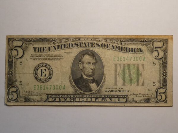 Five dollar bill featuring Abraham Lincoln.