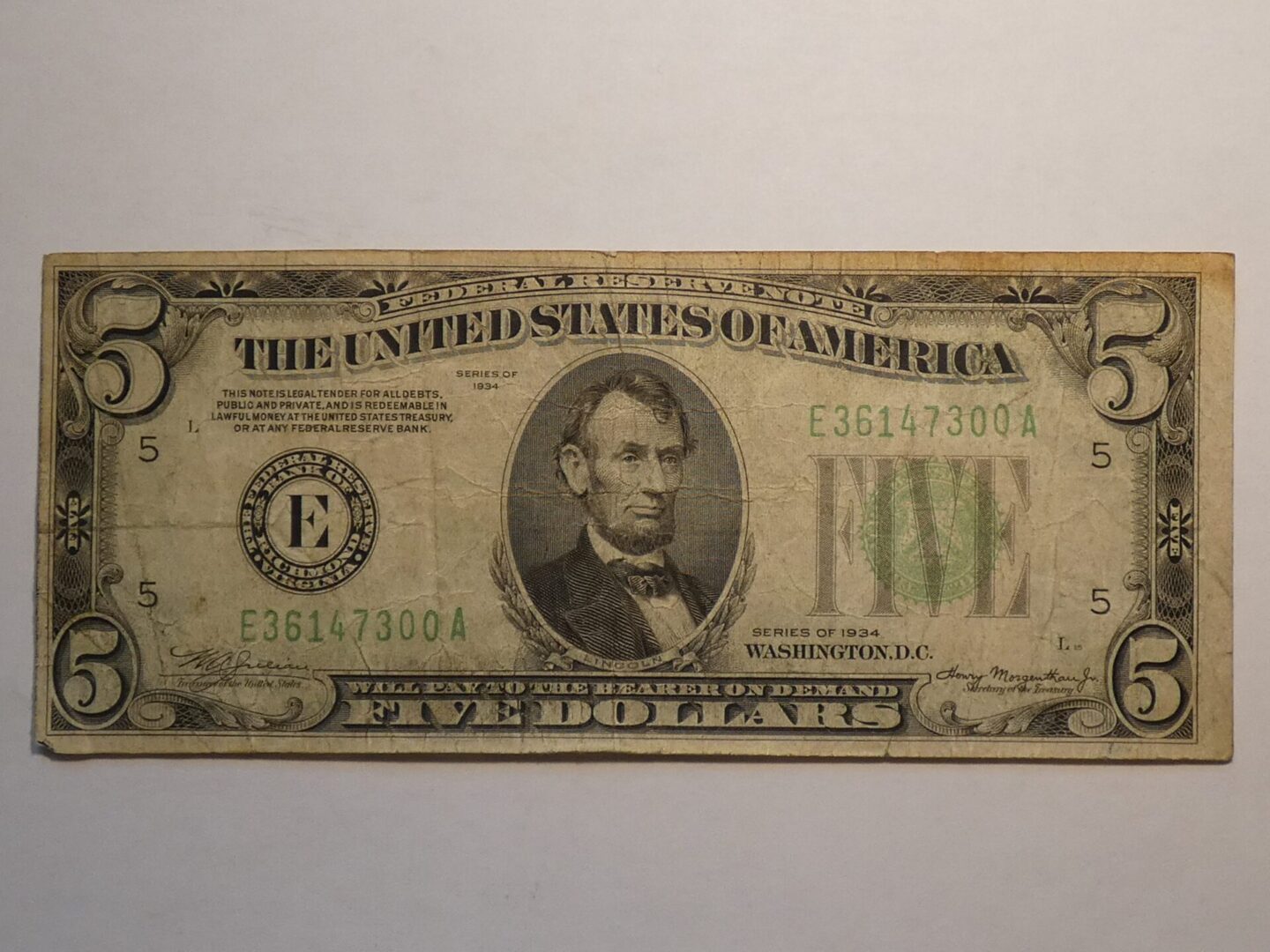 Five dollar bill featuring Abraham Lincoln.