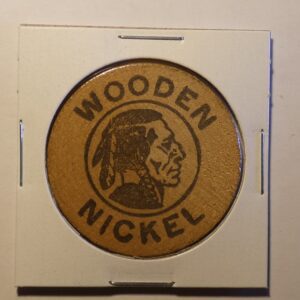 Wooden nickel with Native American profile.