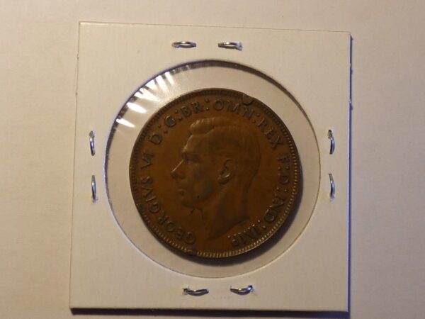 British coin with King George VI portrait.