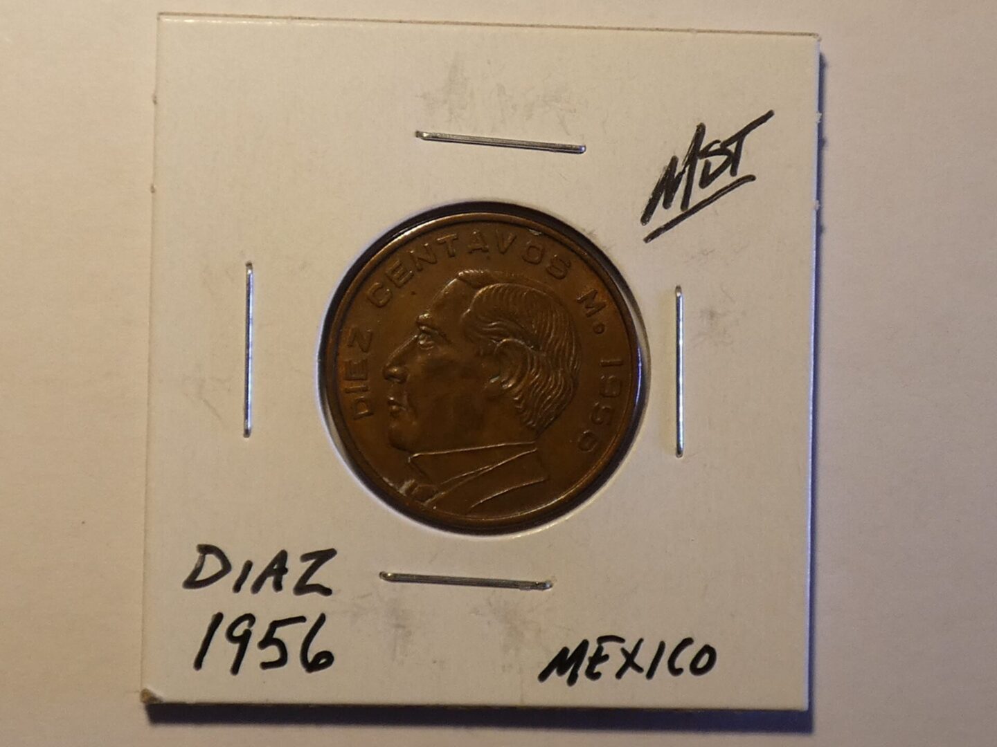 1956 Mexican 10 centavos coin with Diaz portrait.