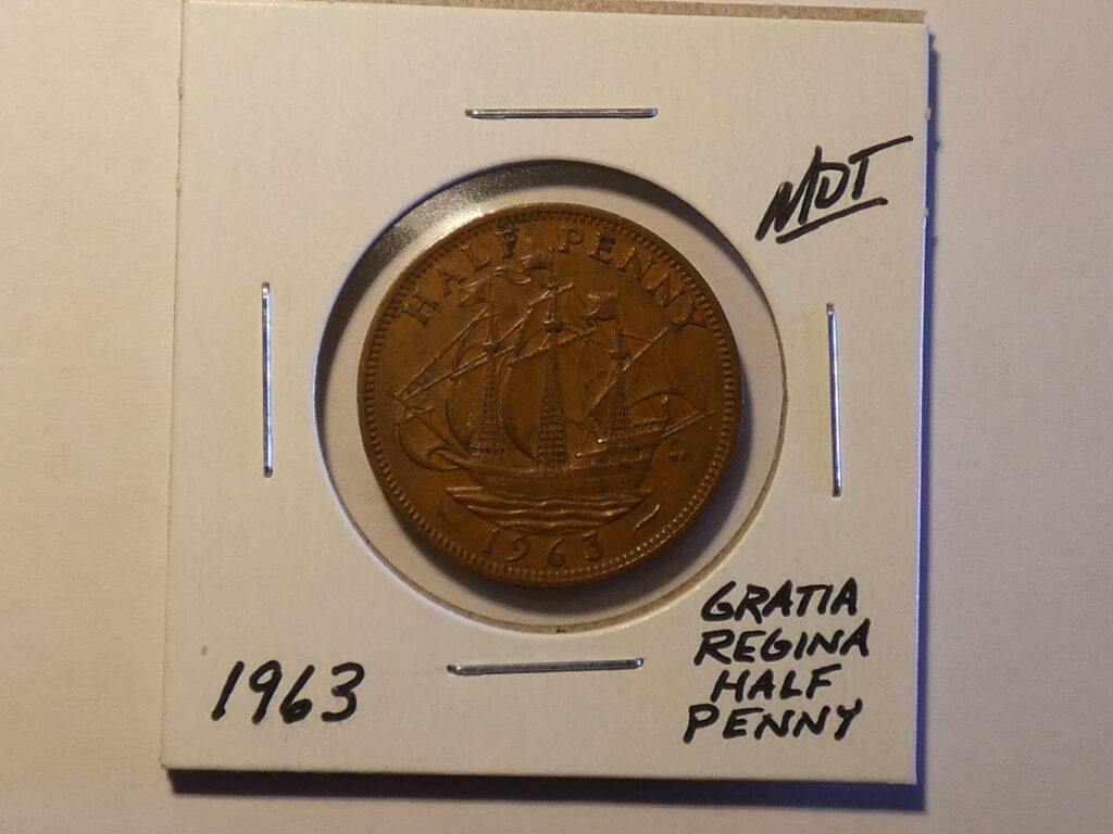 1963 British half penny coin with ship.