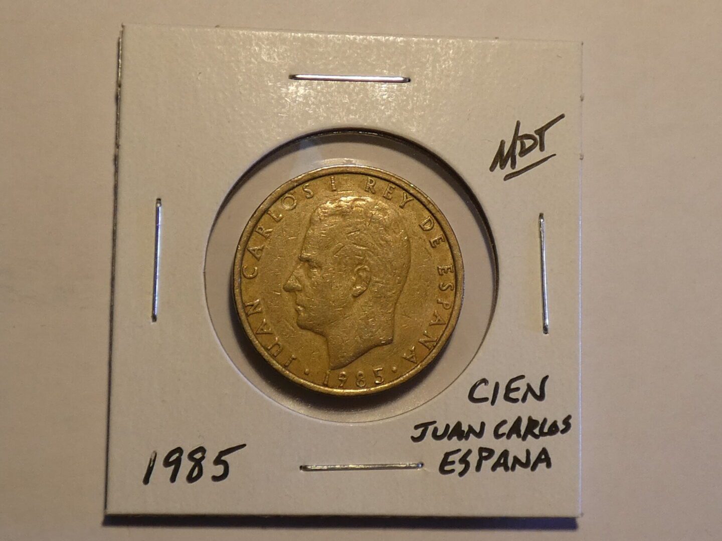 Spanish 100 pesetas coin featuring King Juan Carlos I.