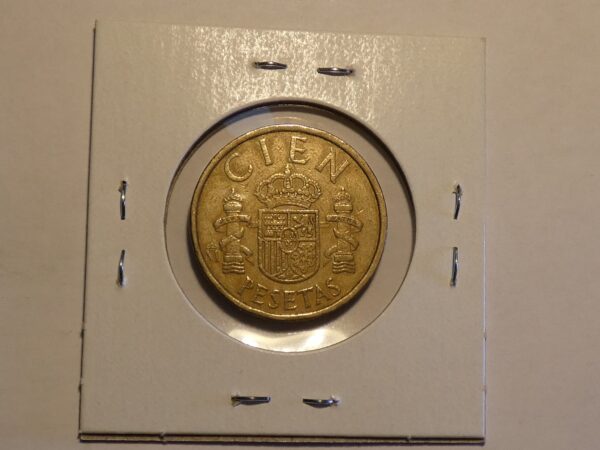 Spanish coin with coat of arms.