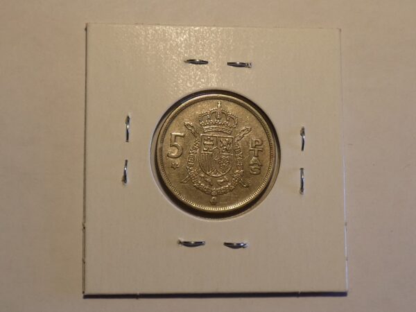 Spanish 5 pesetas coin with coat of arms.