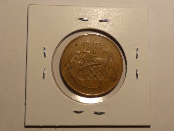 British two pence coin in a display case.