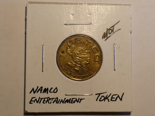 Gold Namco Entertainment token with mascot.