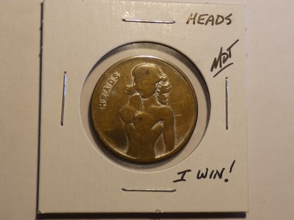 Heads coin with a woman on it.