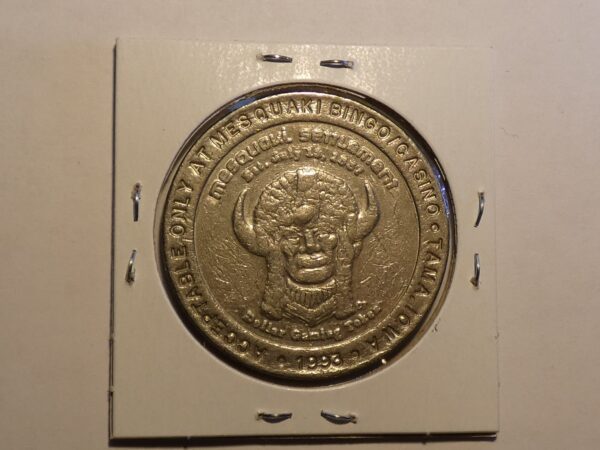 Golden casino token with buffalo head.