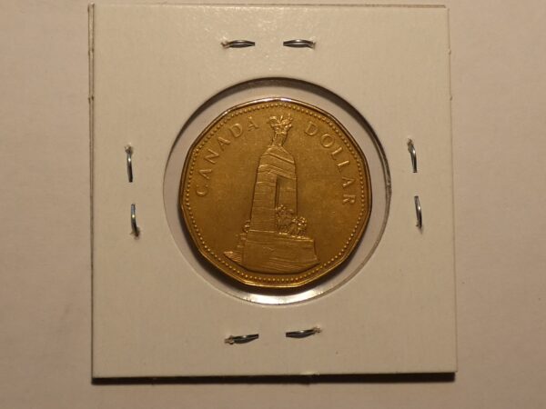 Canadian one dollar coin with the National War Memorial.