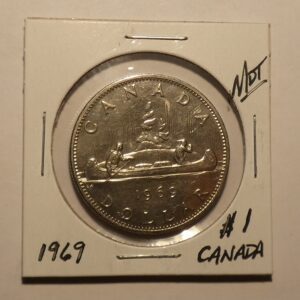 1969 Canadian dollar coin with canoe.