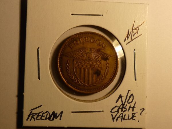 Gold coin with eagle and "Freedom" inscription.