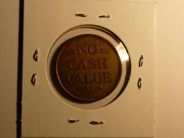 Coin with "No Cash Value" inscription.