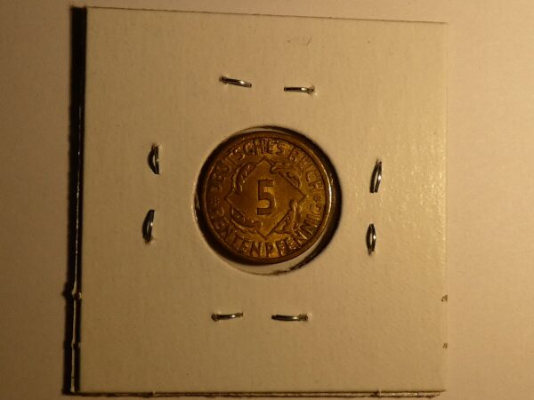 German 5 pfennig coin on display.