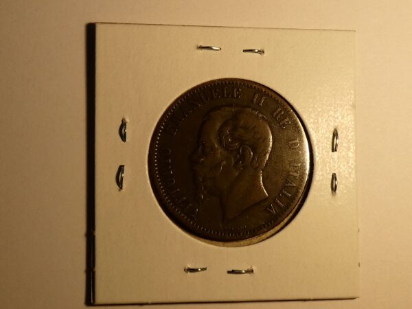 A bronze coin with a man's profile.