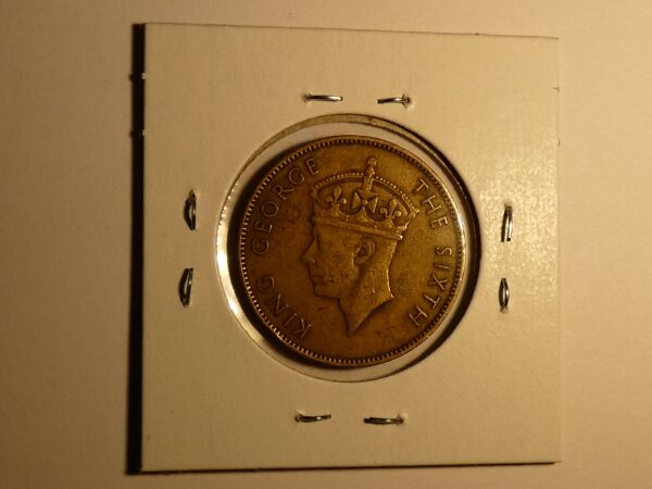 King George VI coin with crown.